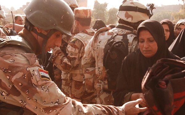 With colder weather on the way, troops distribute heaters in central Baghda