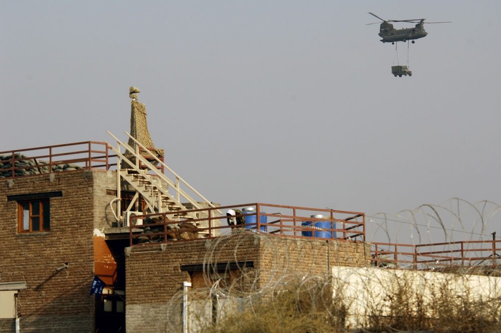 CH-47 Chinook helicopters fly over NPRT FOB