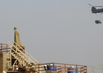 CH-47 Chinook helicopters fly over NPRT FOB