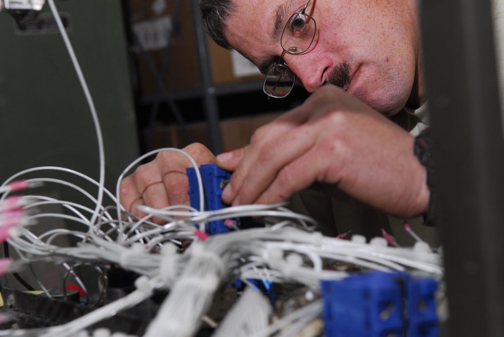 service member rewires power generator