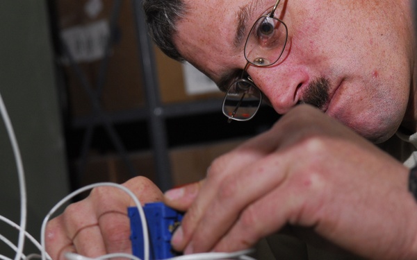 service member rewires power generator
