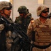 U.S. Army and Iraqi soldiers patrol side by side