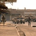 U.S. Army and Iraqi soldiers patrol side by side