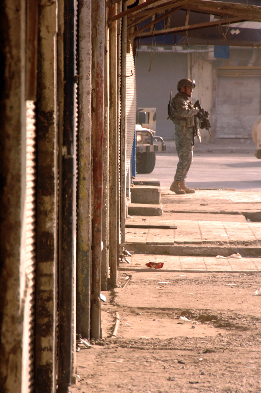 U.S. Army and Iraqi soldiers patrol side by side