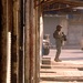 U.S. Army and Iraqi soldiers patrol side by side