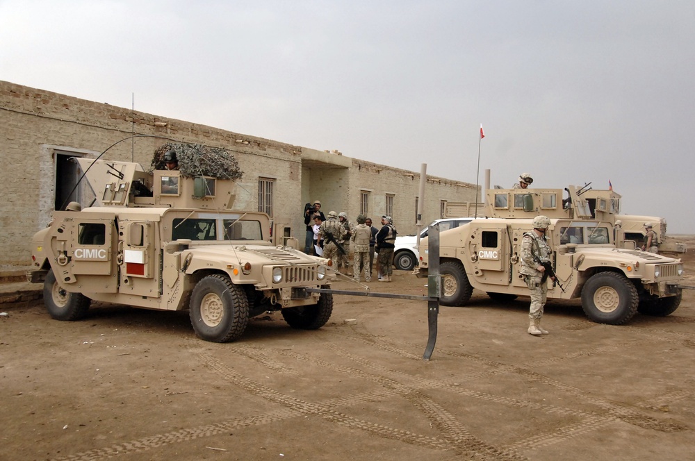 Civil military cooperation officisl visit Iraqi elementary school