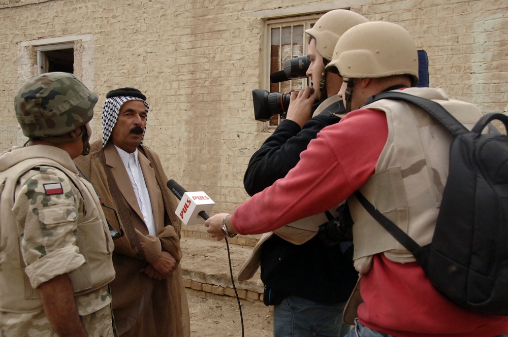 Civil military cooperation officisl visit Iraqi elementary school