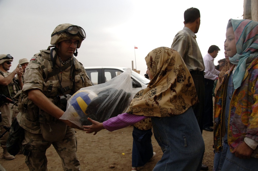 Civil military cooperation officisl visit Iraqi elementary school