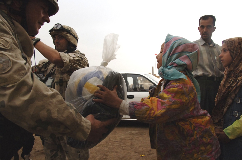 Civil military cooperation officisl visit Iraqi elementary school