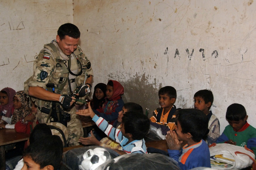 Civil military cooperation officisl visit Iraqi elementary school