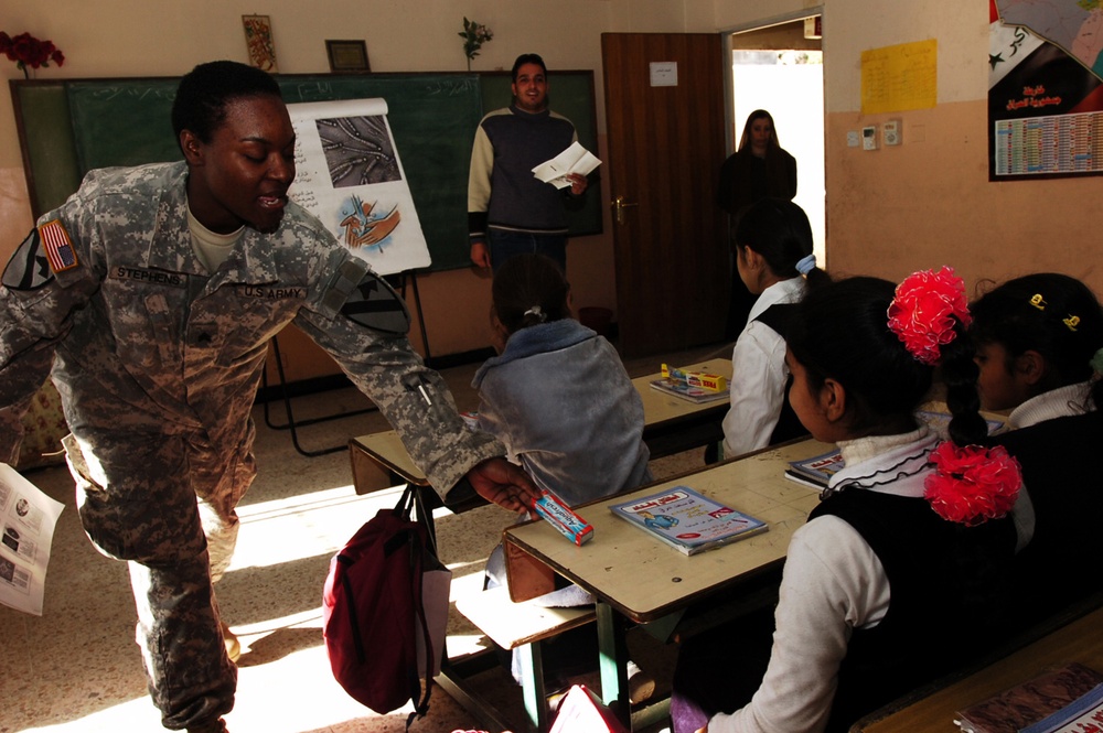 Black Jack Soldiers show Salhiyah children how to stay healthy