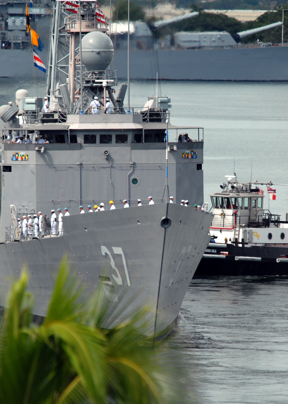 Sailors aboard USS Crommelin man the rails