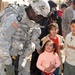 Automatic Soldiers give to Iraqis during holiday season