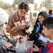 Automatic Soldiers give to Iraqis during holiday season