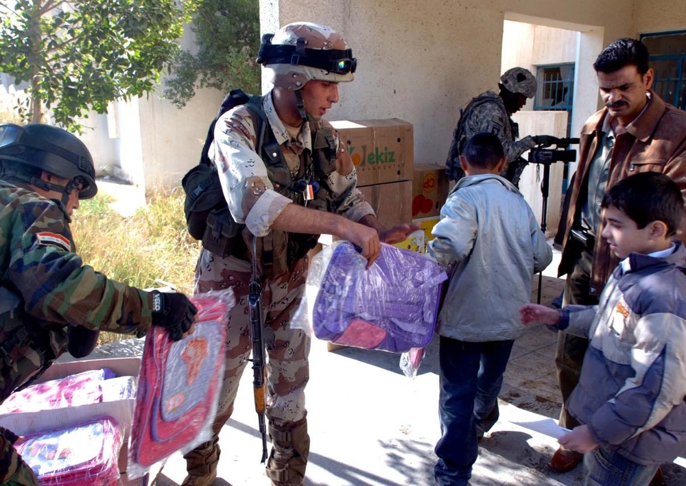 Iraqi Army, U.S. Troops Deliver Backpacks to School Children
