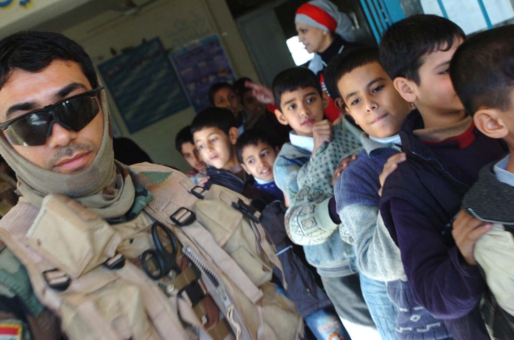 Iraqi Army, U.S. Troops Deliver Backpacks to School Children