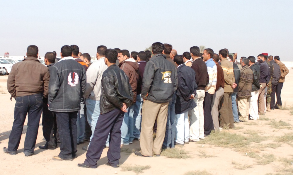 Iraqi Police pick up vehicles from Abu Ghraib