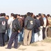 Iraqi Police pick up vehicles from Abu Ghraib