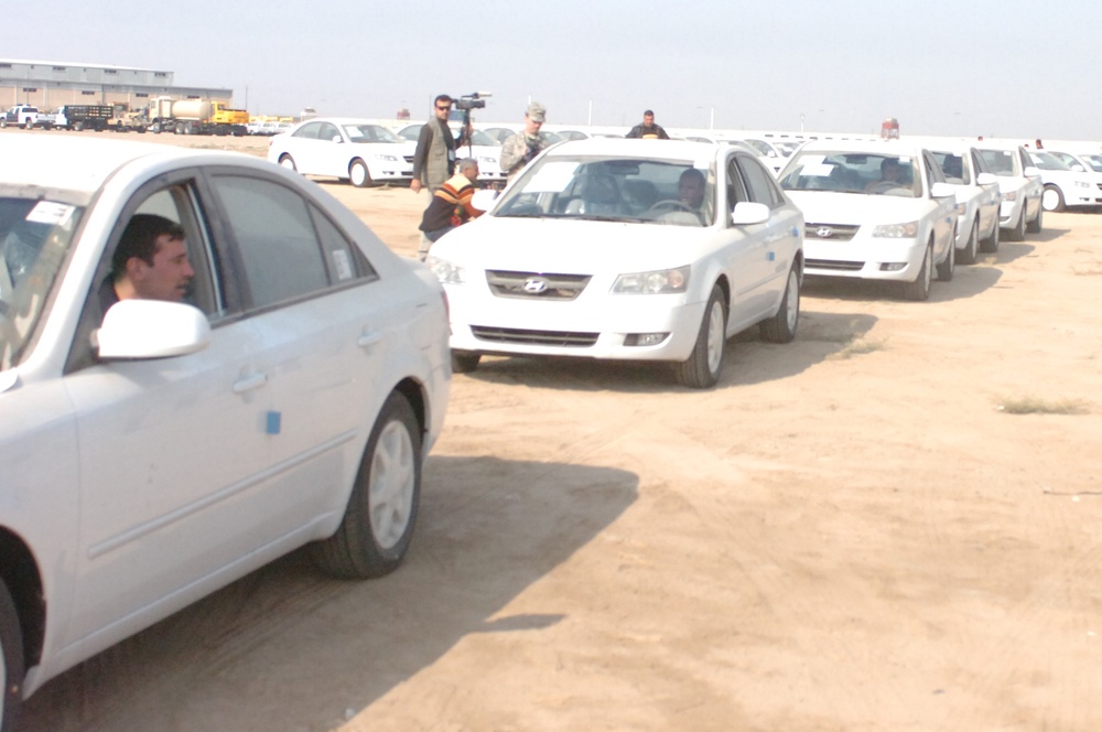 Iraqi Police pick up vehicles from Abu Ghraib