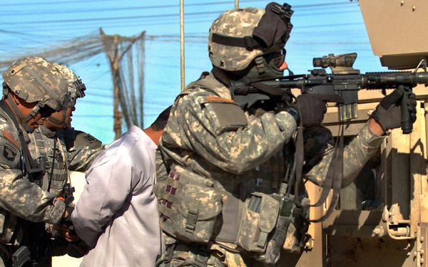3rd ACR Redleg Cav Troopers detain HVT while under fire
