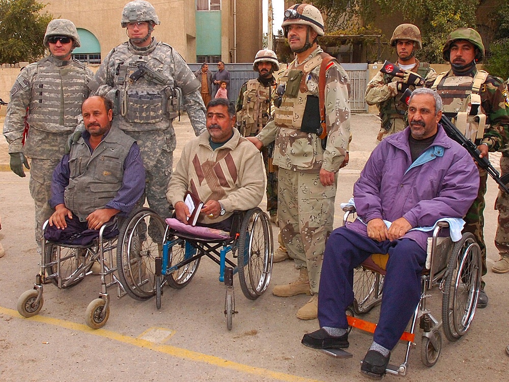 IA Soldiers distribute wheelchairs