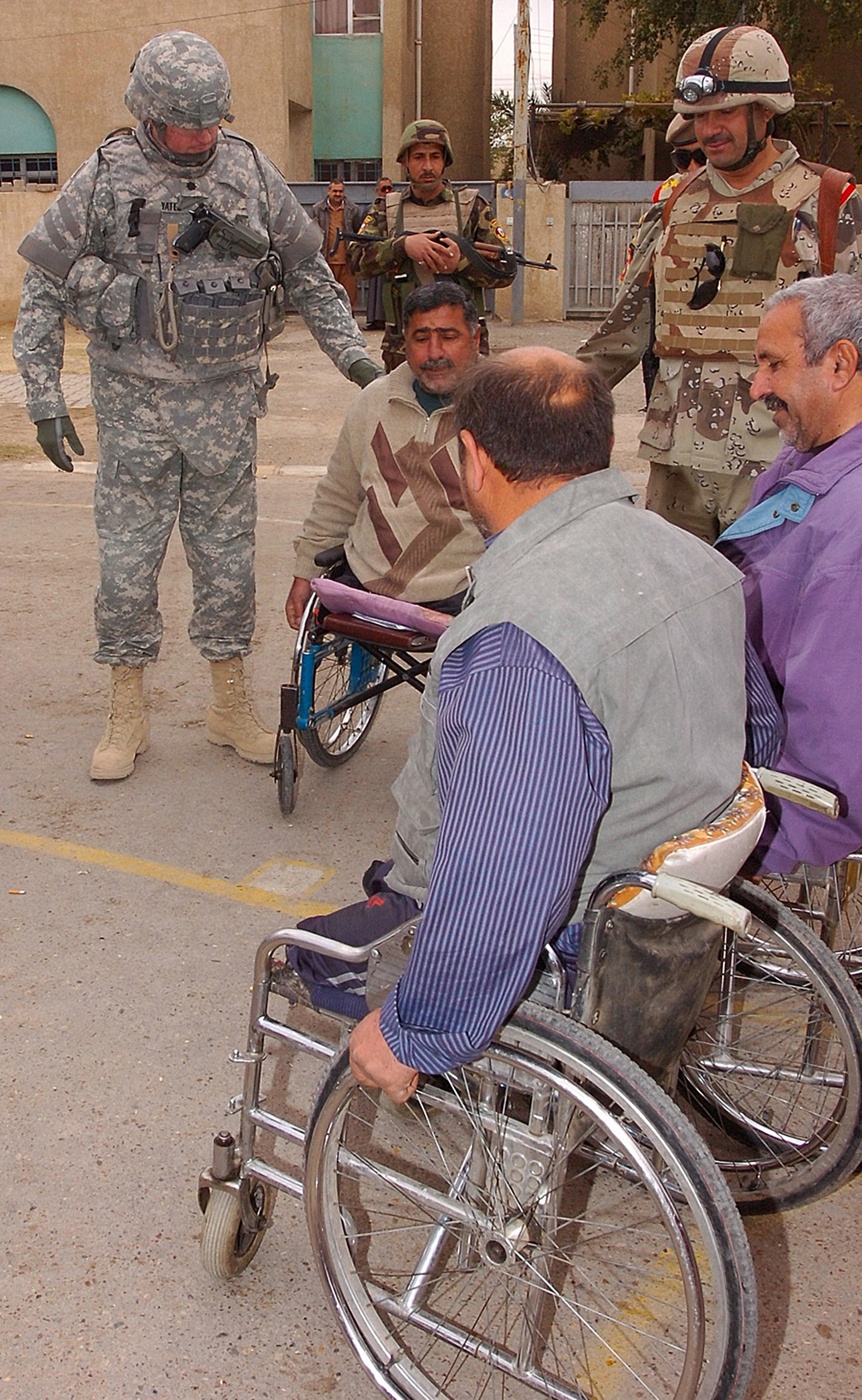 IA Soldiers distribute wheelchairs