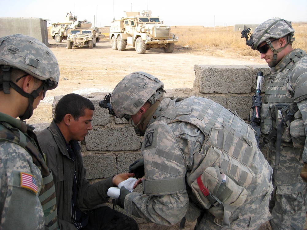 1-10th Mountain Soldiers Render Medical Aid to Injured Iraqi