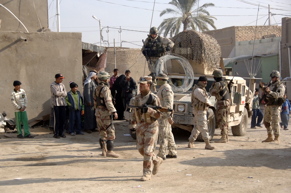 Soldiers distribute care packages to Iraqi civilians