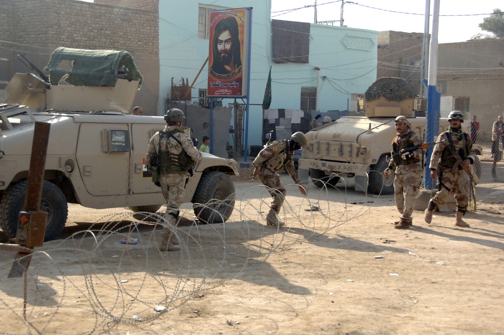 Soldiers distribute care packages to Iraqi civilians