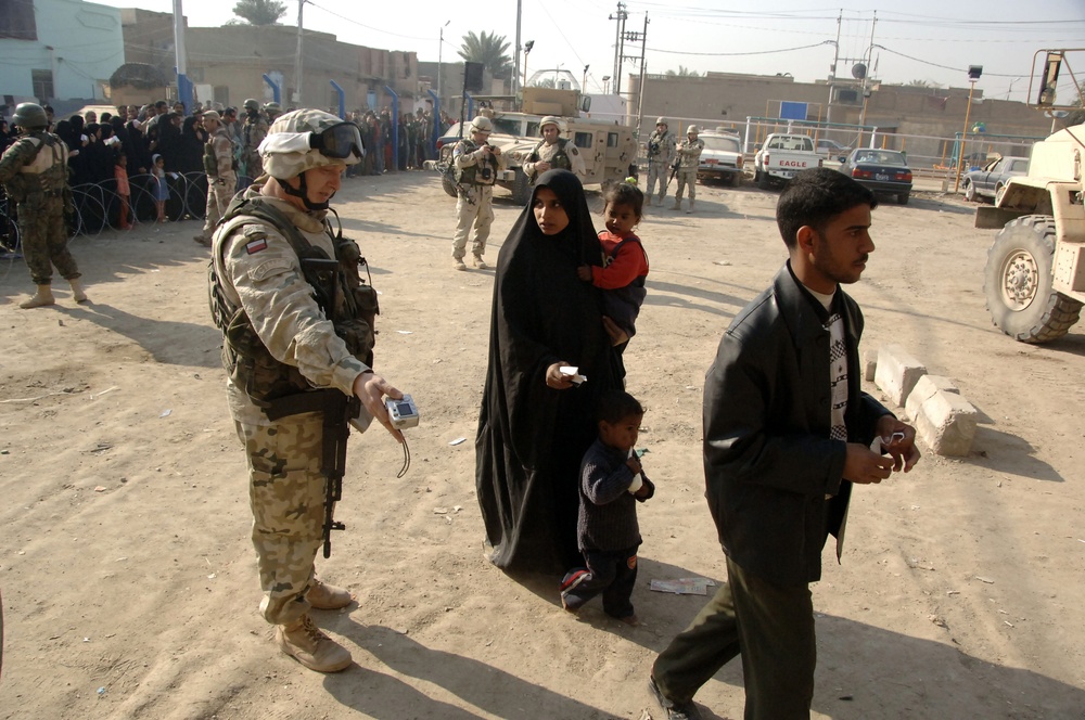 Soldiers distribute care packages to Iraqi civilians