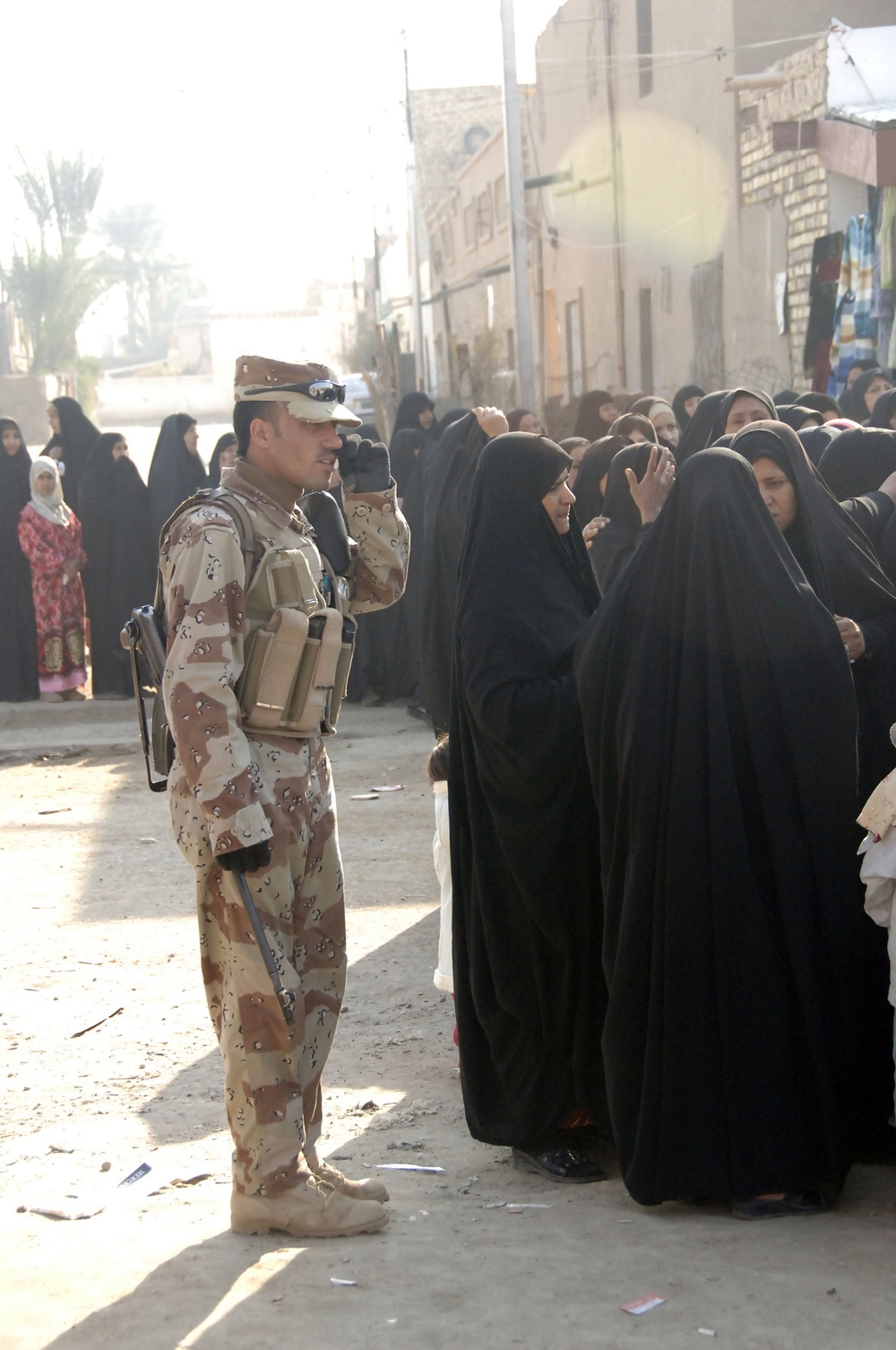 Soldiers distribute care packages to Iraqi civilians