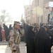 Soldiers distribute care packages to Iraqi civilians