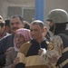 Soldiers distribute care packages to Iraqi civilians