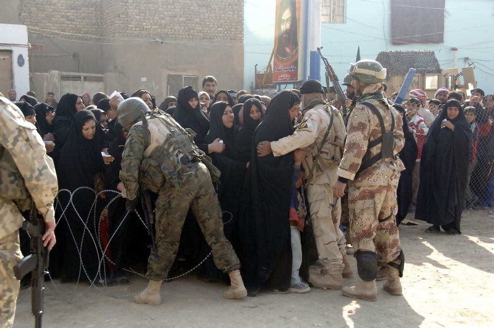 Soldiers distribute care packages to Iraqi civilians