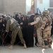 Soldiers distribute care packages to Iraqi civilians