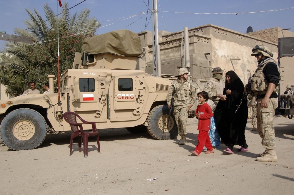 Soldiers distribute care packages to Iraqi civilians