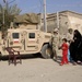 Soldiers distribute care packages to Iraqi civilians