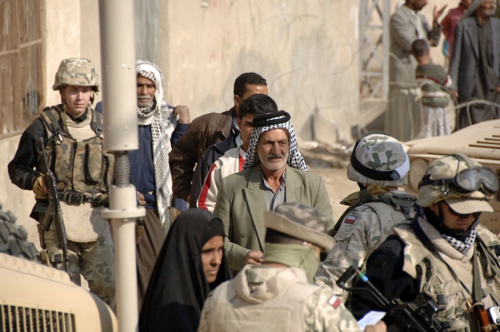 Soldiers distribute care packages to Iraqi civilians