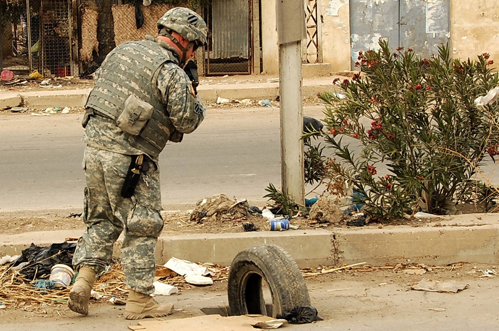 IA, U.S. troops on patrol in northwest Baghdad