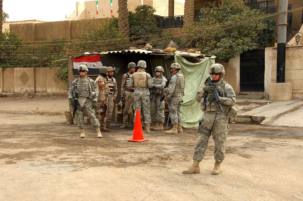 IA, U.S. troops on patrol in northwest Baghdad