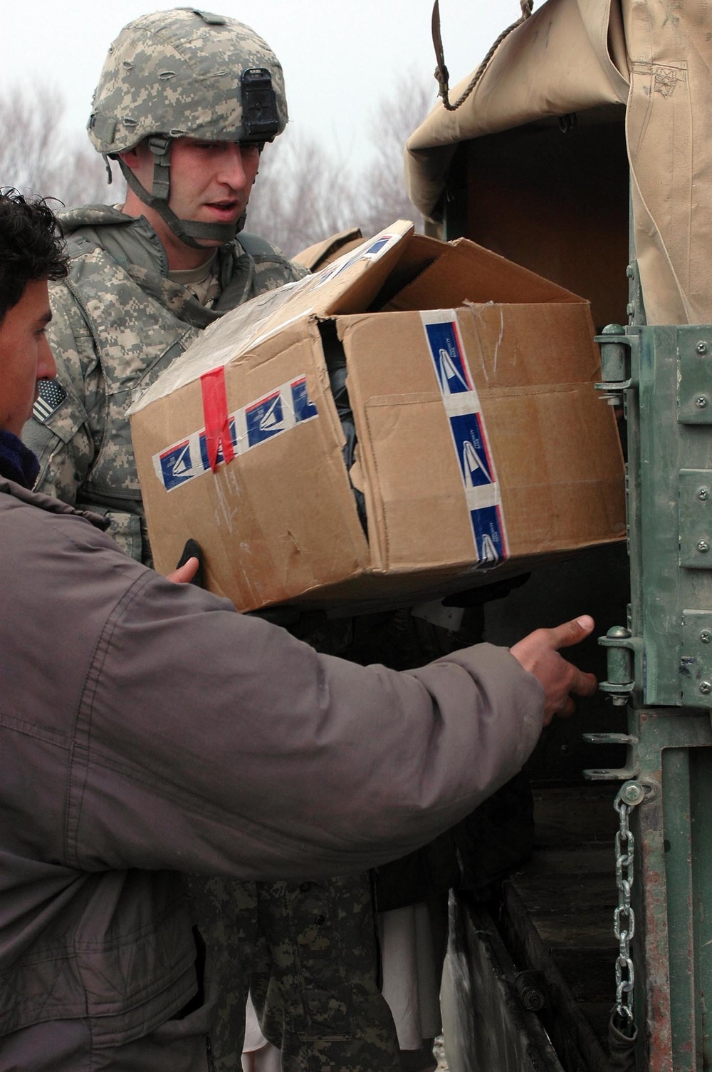 Bagram PRT delivers cold weather items, food to Mahmood Raqi District human