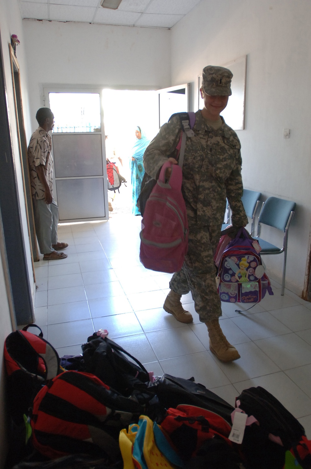 CJTF-HOA Volunteers Donate Book Bags With Supplies to Orphans