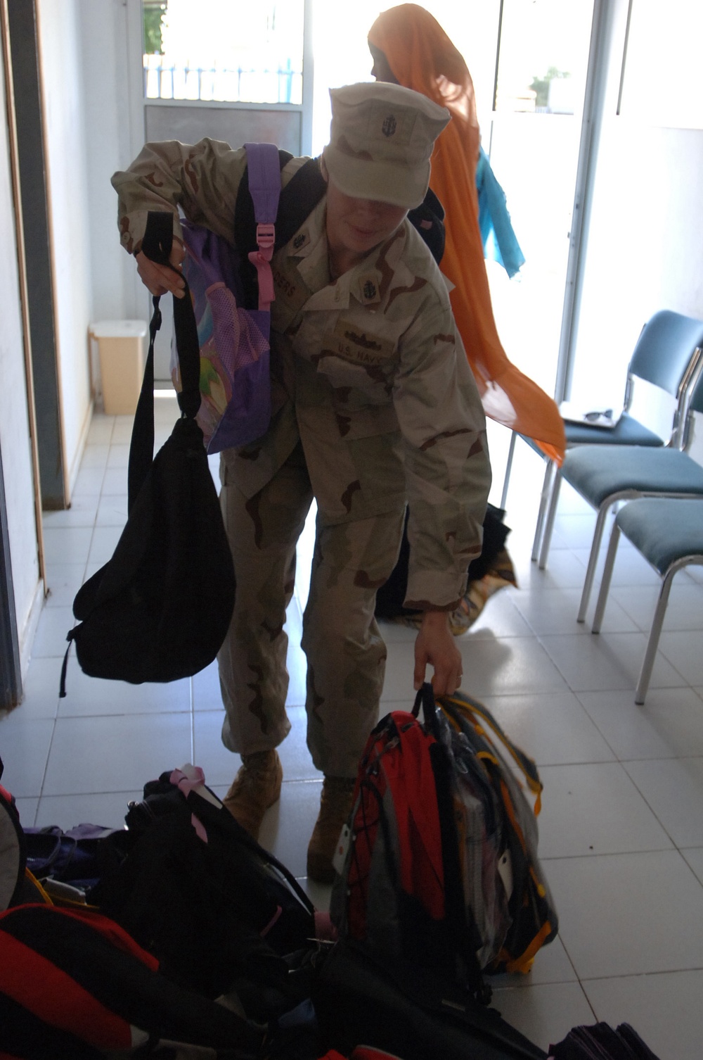 CJTF-HOA volunteers donate book bags with supplies to orphans
