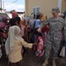CJTF-HOA volunteers donate book bags with supplies to orphans
