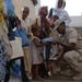 CJTF-HOA volunteers donate book bags with supplies to orphans