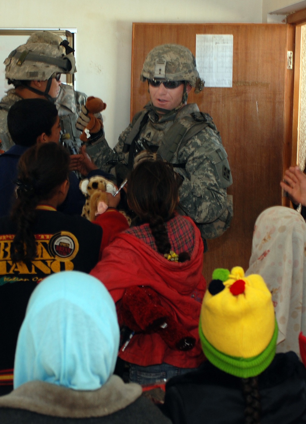 Striker Soldiers bring gifts to village school children