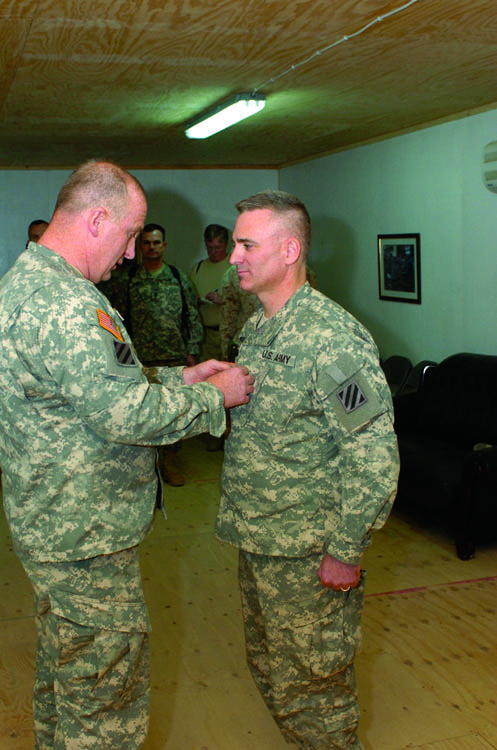 Nicolle attains rank of Colonel, family watches from home