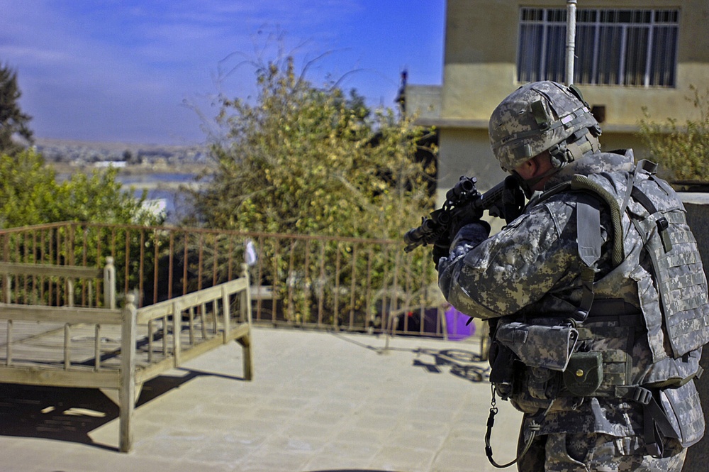 Forward observers paint targets for artillery strike in Mosul