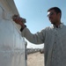 Iraqi Security Forces, local shop owners clean up Four Corners market district