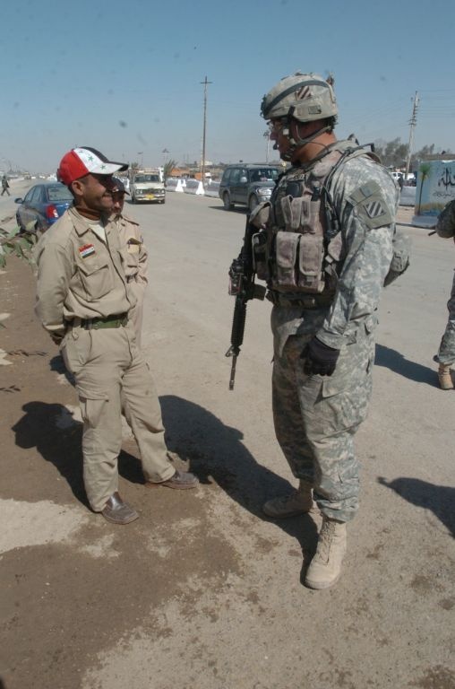 Iraqi Security Forces, local shop owners clean up Four Corners market district